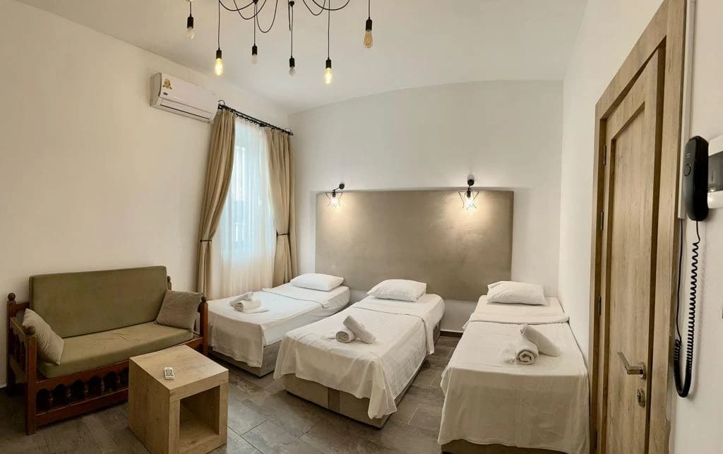 Triple Single Room interior at Avenue Hotel Girne