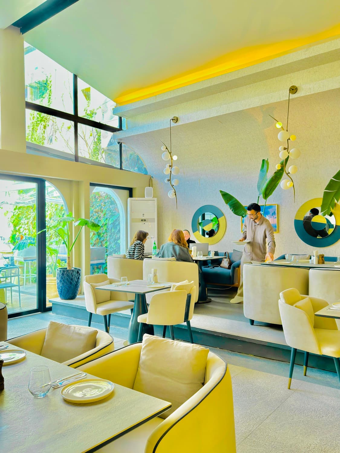The light-filled dining hall at Avenue Hotel
